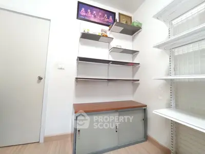 Compact storage room with shelves and cabinet, ideal for organizing essentials.
