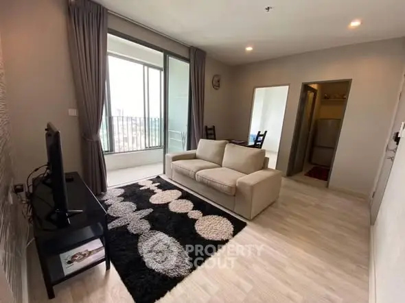 Modern living room with cozy sofa and large window view