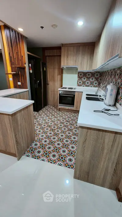 Modern kitchen with stylish patterned tiles and wooden cabinets
