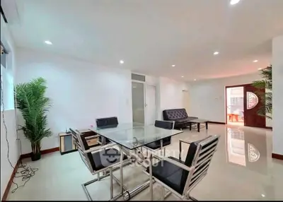 Spacious modern living room with sleek dining area and stylish decor