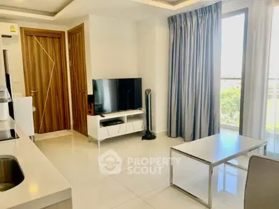 Modern living room with sleek design, large window, and stylish furniture in a bright apartment.