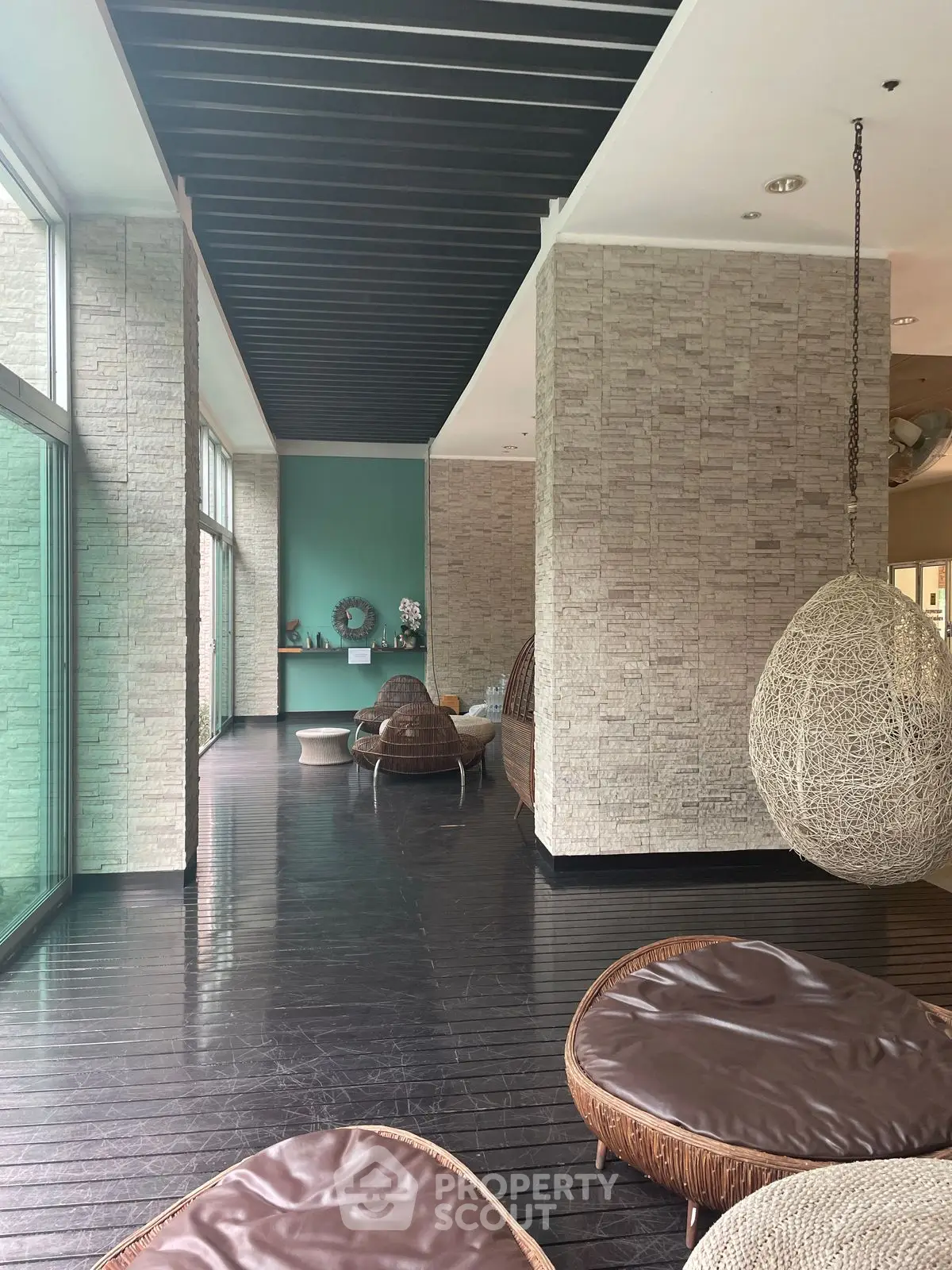 Luxurious modern living area with stylish hanging chairs and elegant decor