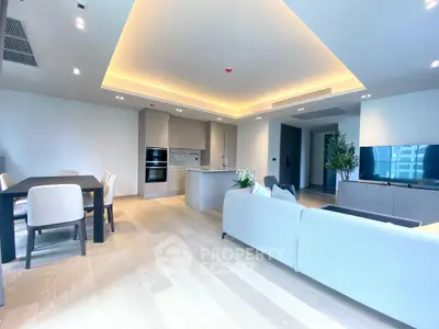 Luxurious open-plan living room with modern kitchen and elegant dining area