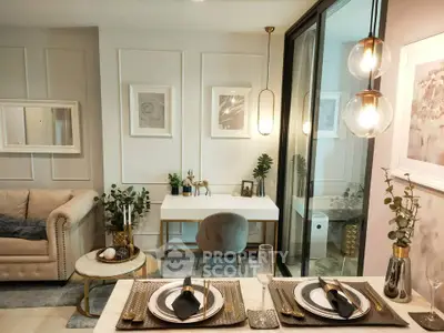 Elegant living room with stylish decor and dining setup, featuring modern lighting and chic furnishings.