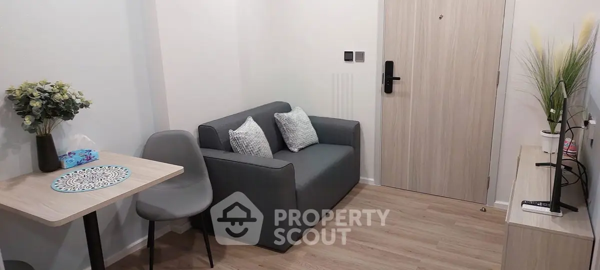 Cozy modern living room with stylish decor and compact furniture