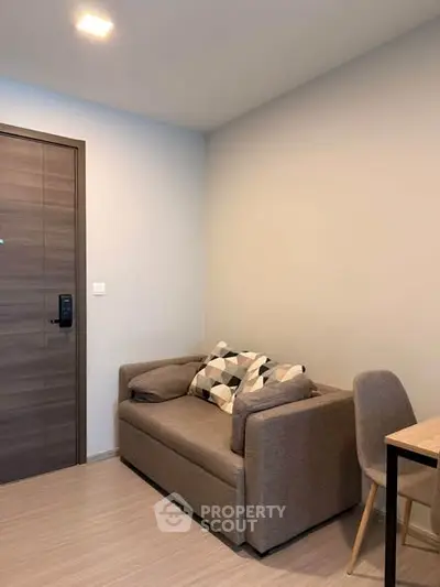 Cozy living room with modern sofa and stylish decor in a contemporary apartment.