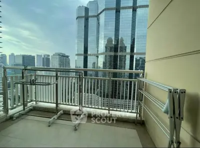 Spacious balcony with stunning city skyline view, perfect for urban living.