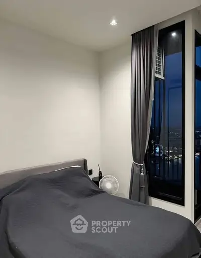 Modern bedroom with city view and elegant decor