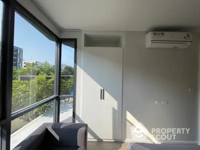 Modern apartment corner with large windows and air conditioning