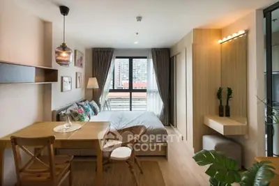 Chic modern bedroom with city view, stylish decor, and natural light.