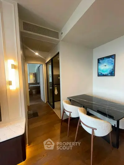 Modern dining area with elegant chairs and marble table in a stylish apartment