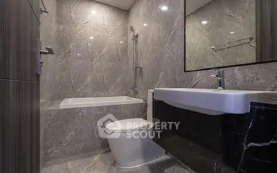 Luxurious modern bathroom with marble walls and sleek fixtures