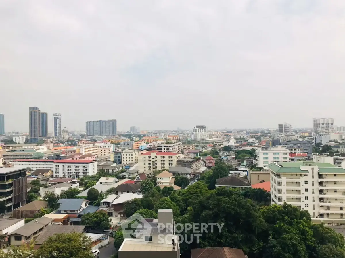 Stunning cityscape view showcasing diverse architecture and lush greenery.