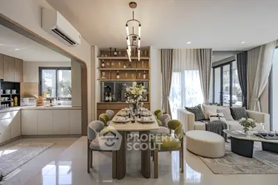 Luxurious open-plan living and dining area with modern decor and ample natural light.