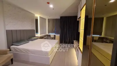 Modern bedroom with stylish decor and ample storage space