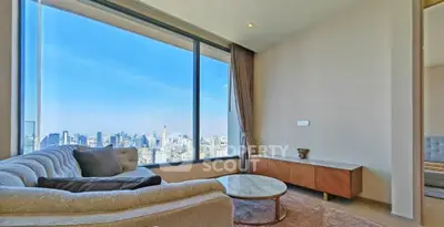 Luxurious living room with stunning city view and modern furnishings.