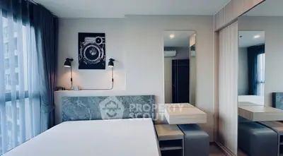 Modern bedroom with stylish decor and large window view