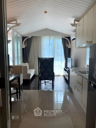 Chic modern living room with sleek kitchen and stylish decor