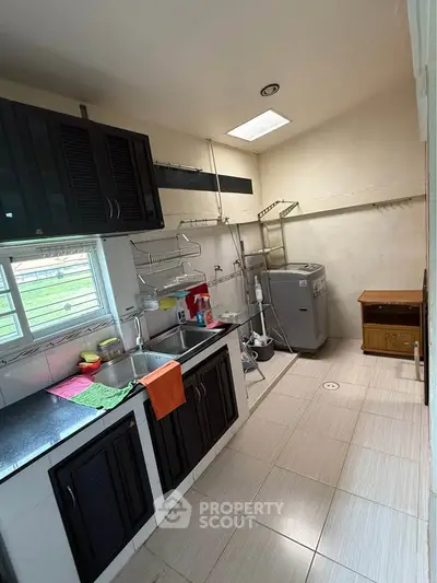 Spacious kitchen with modern appliances and ample storage space