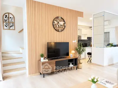 Modern living room with stylish wooden paneling and sleek TV setup