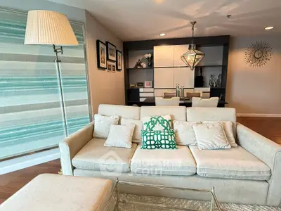 Elegant living room with modern decor and cozy seating area, perfect for relaxation and entertaining.