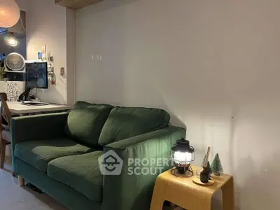 Cozy living room with green sofa and modern decor