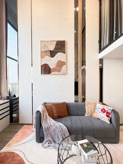 Stylish modern living room with high ceilings and elegant decor