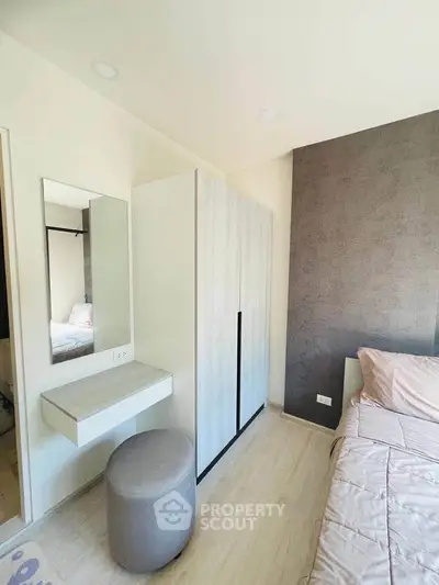 Modern bedroom with stylish wardrobe and cozy decor