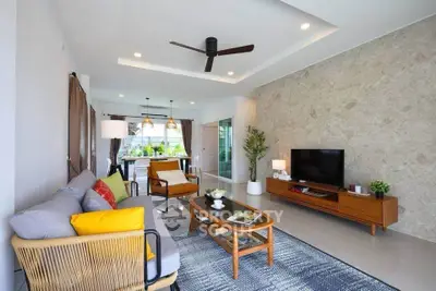 Spacious modern living room with stylish decor and natural light