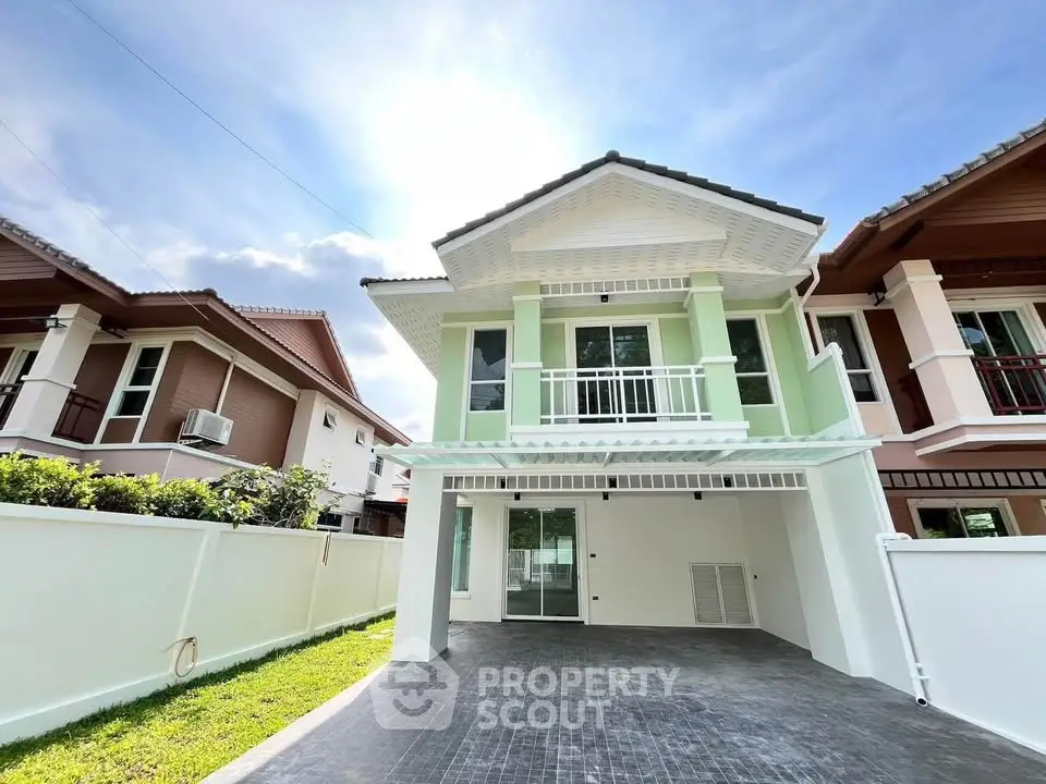 Charming two-story house with modern design and spacious driveway in a serene neighborhood.