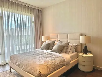 Elegant bedroom with modern decor and natural light