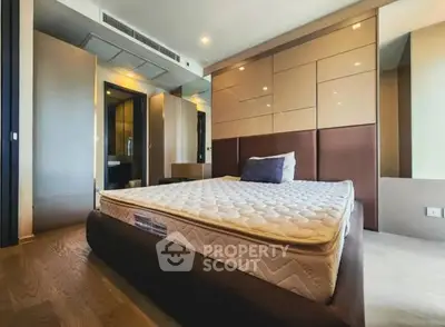 Spacious modern bedroom with stylish decor and comfortable bed