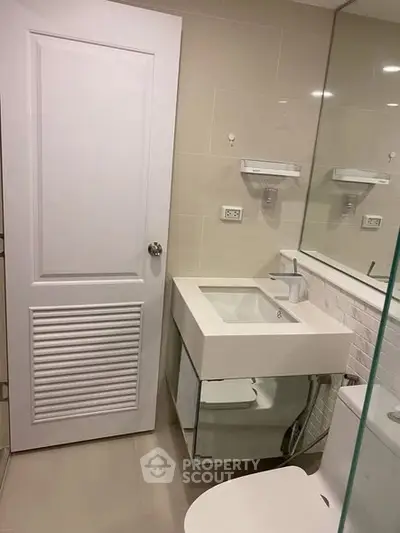 Modern bathroom with sleek sink and mirror design