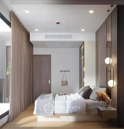 Modern bedroom with elegant decor and natural light, featuring a cozy bed and stylish lighting.