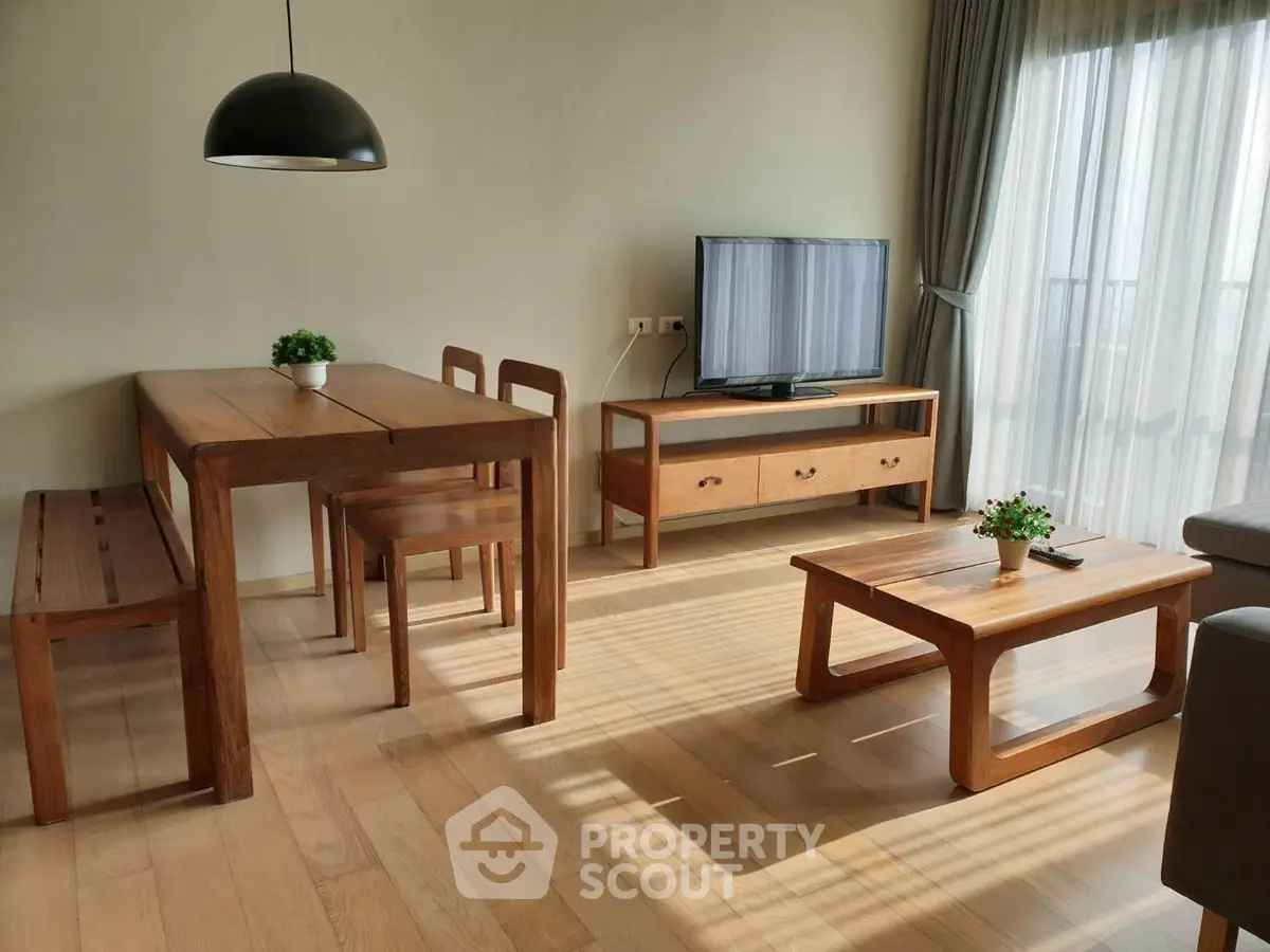 Modern living room with wooden furniture and natural light