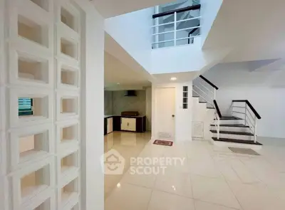 Modern interior with sleek staircase and open layout in a stylish home