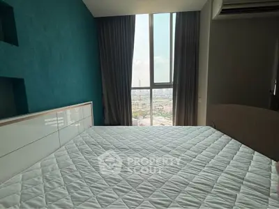 Modern bedroom with large window offering stunning city view, featuring minimalist design and cozy ambiance.