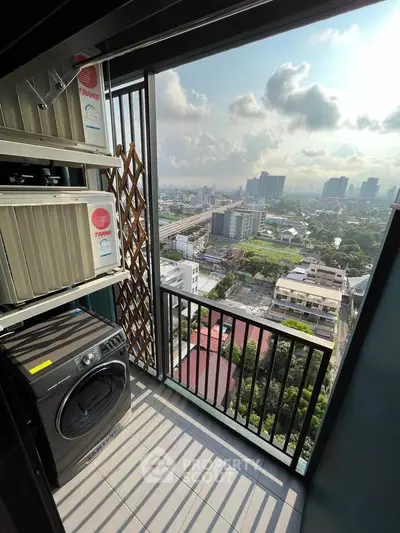 Stunning high-rise balcony with cityscape view and modern laundry setup.