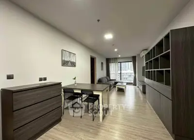 Modern living room with sleek furniture and city view, perfect for urban living.