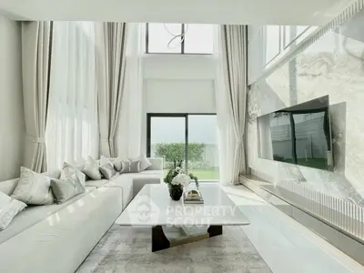 Luxurious modern living room with high ceilings and elegant decor