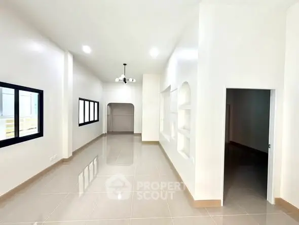 Spacious and bright living room with modern design and large windows