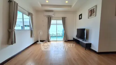 Spacious living room with wooden flooring and modern decor