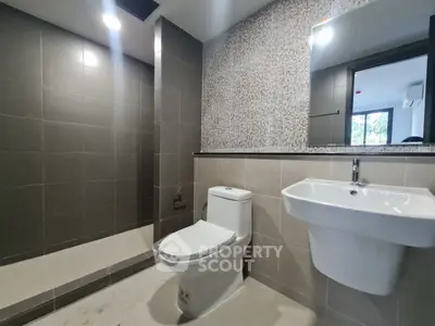 Modern bathroom with sleek design and elegant fixtures in a contemporary home.