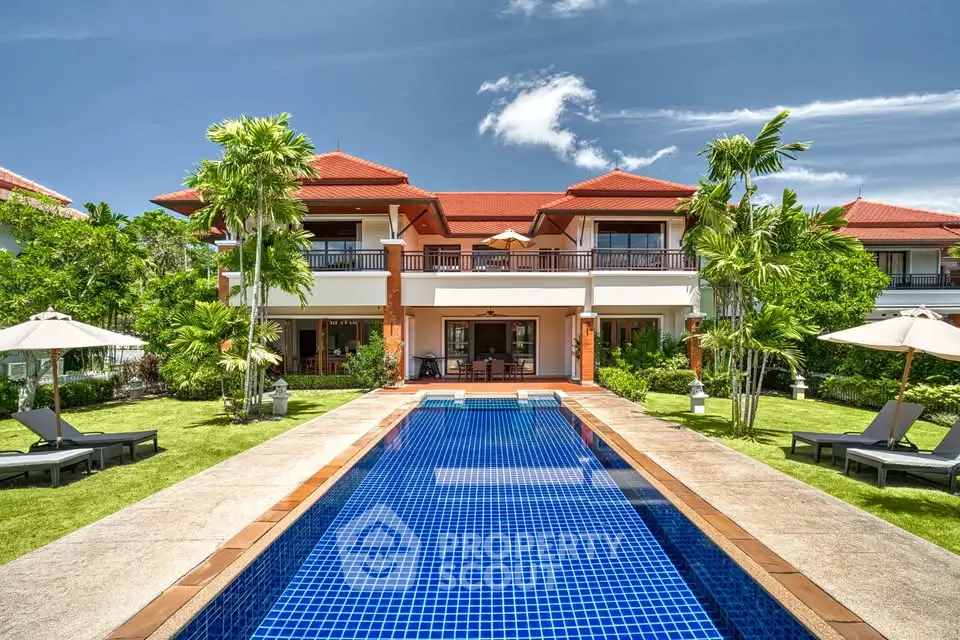 Luxurious villa with private pool and lush garden, perfect for tropical living.