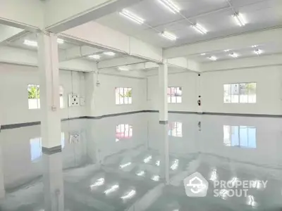 Spacious industrial warehouse with polished floors and ample natural light