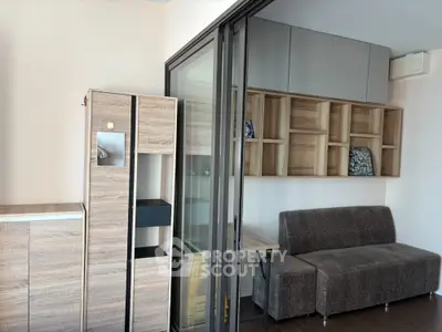 Modern living room with stylish wooden cabinets and cozy sofa