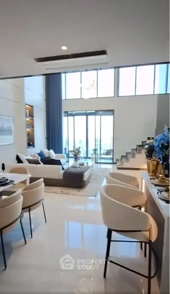 Luxurious modern living room with high ceilings and elegant decor