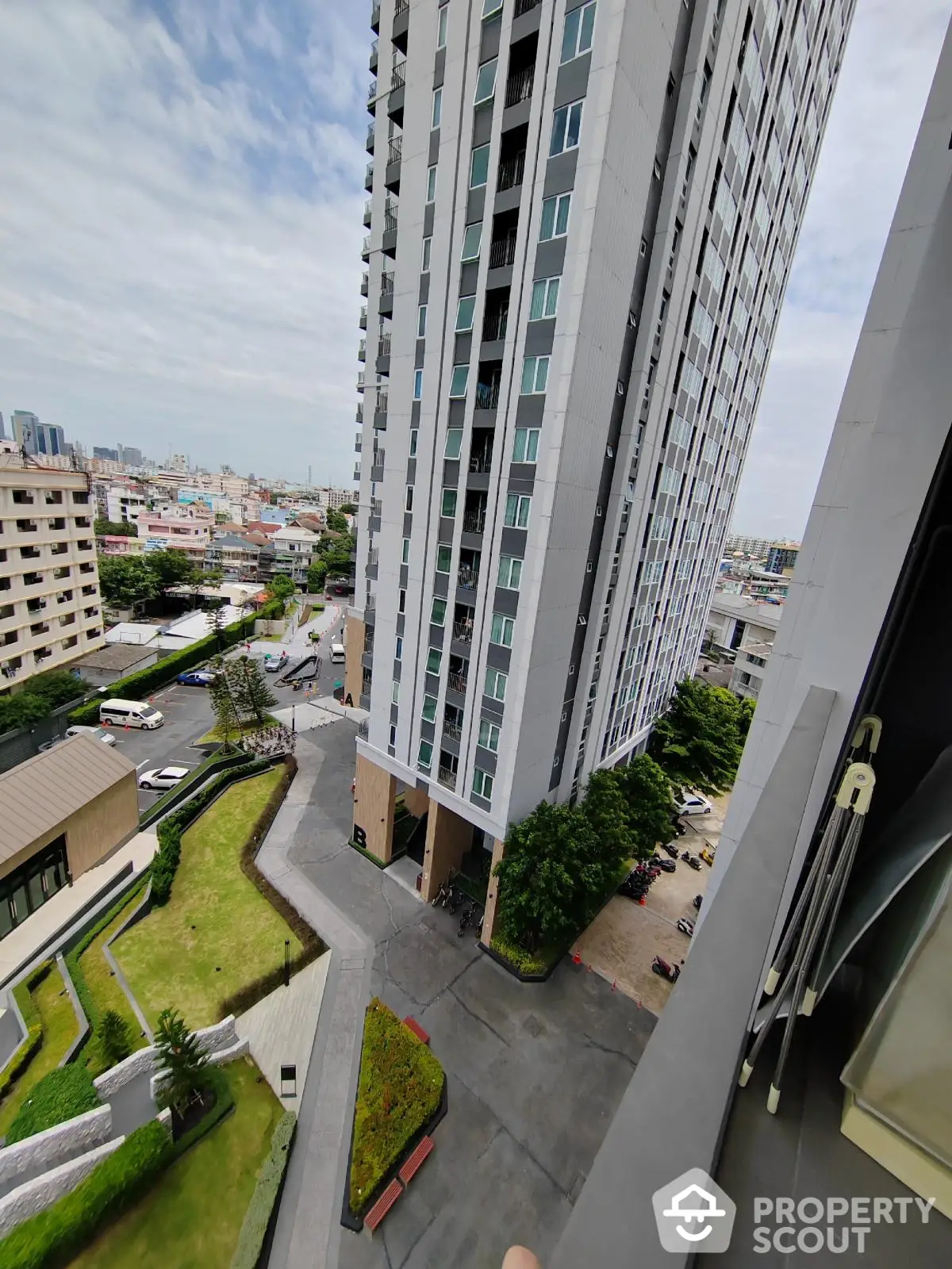 High-rise building with city view and landscaped surroundings