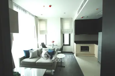 Modern living room with sleek kitchen in open layout apartment