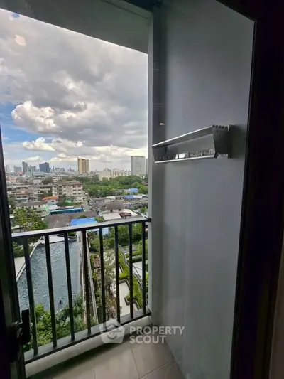 Charming balcony with stunning cityscape view, perfect for relaxation and enjoying urban living.